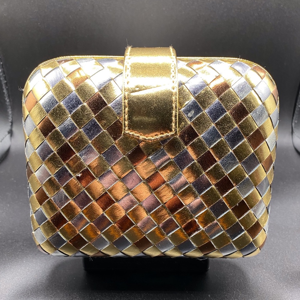 Tri-color gold,silver,bronze clutch with gold strap. NEW without tags.